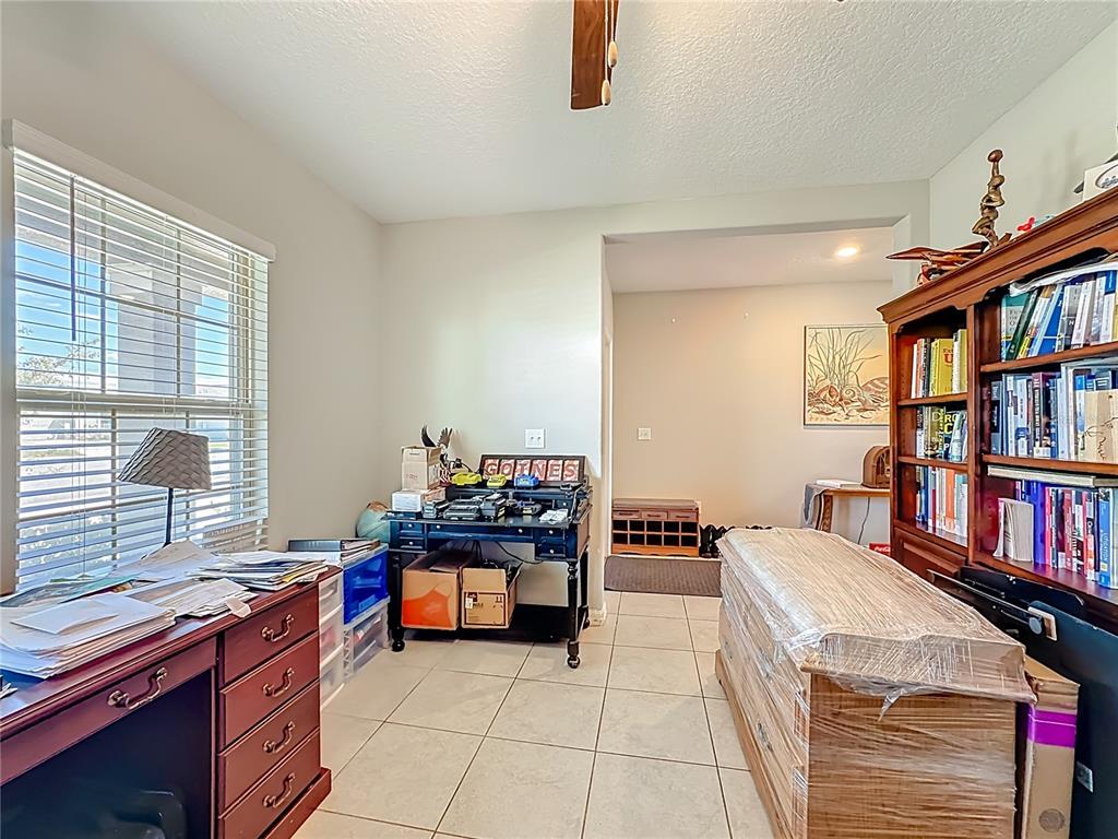 1511 Tiger Tooth Place Ruskin, FL 33570 - Photo 17 of 59 a room with furniture and book shelf
