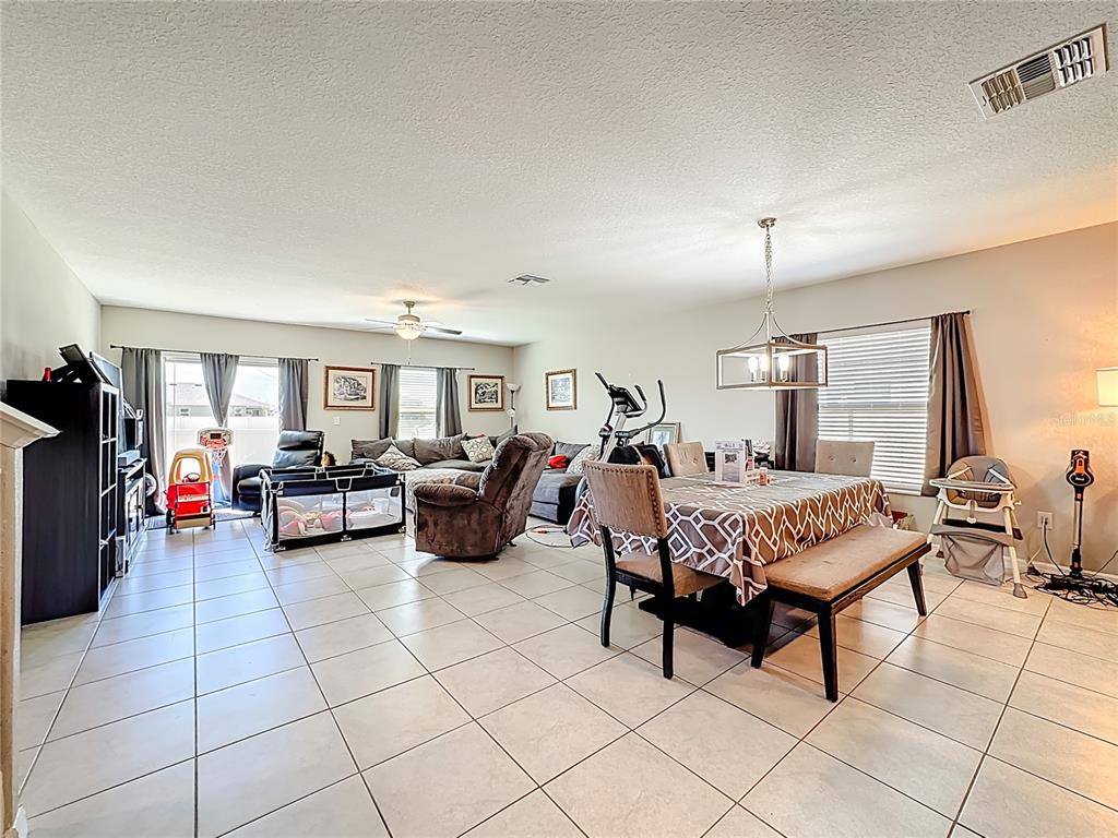 1511 Tiger Tooth Place Ruskin, FL 33570 - Photo 24 of 59 a living room with furniture and a window