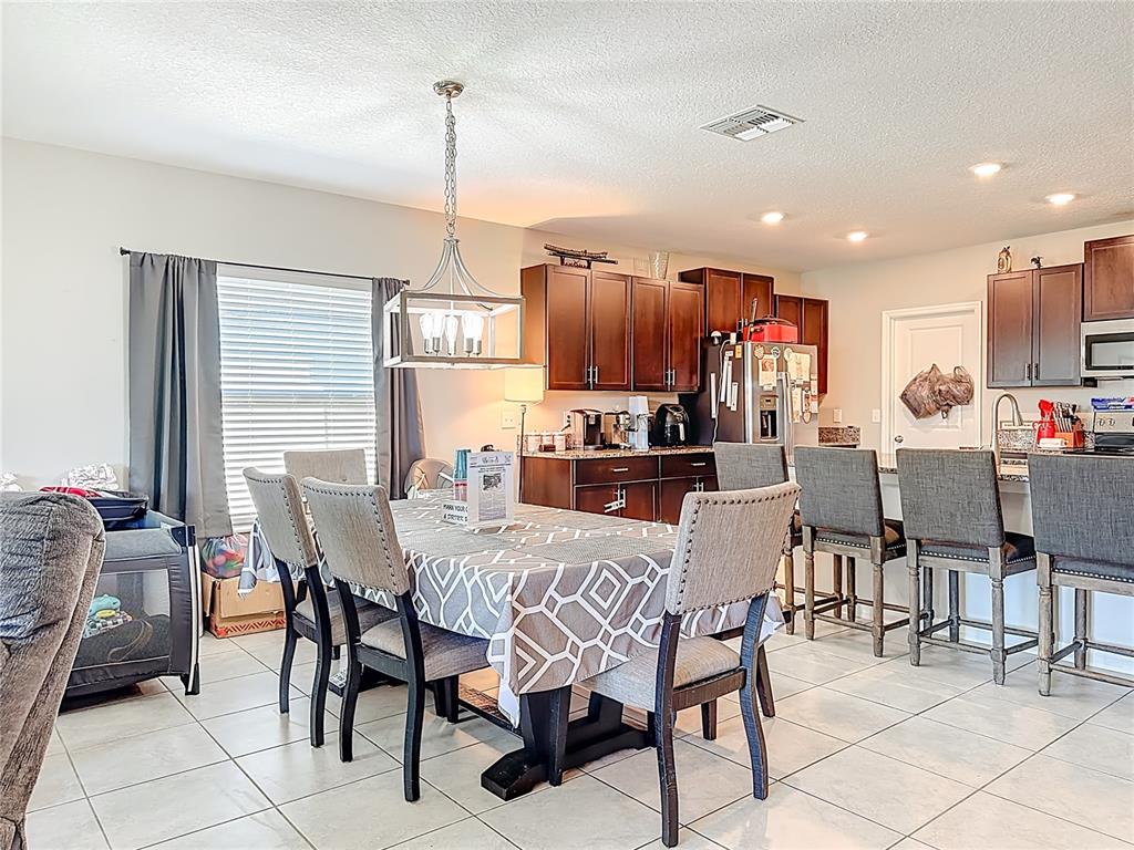 1511 Tiger Tooth Place Ruskin, FL 33570 - Photo 25 of 59 a view of a dining room with furniture