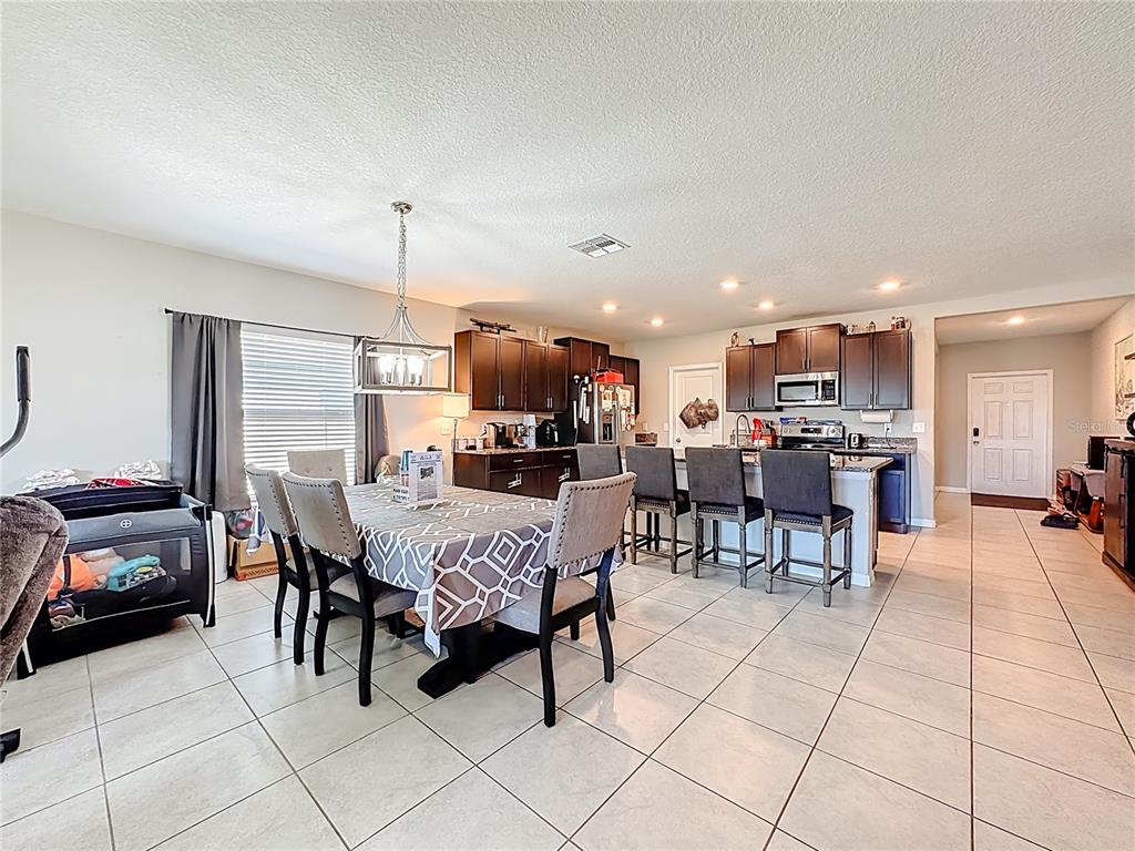 1511 Tiger Tooth Place Ruskin, FL 33570 - Photo 26 of 59 a view of a dining area with furniture