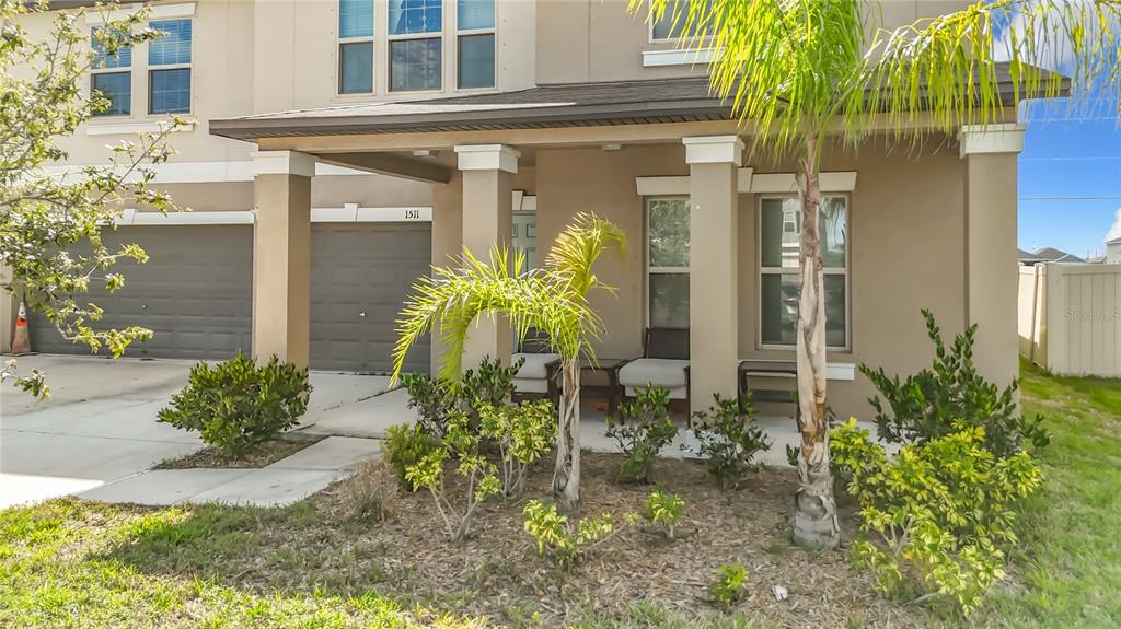 1511 Tiger Tooth Place Ruskin, FL 33570 - Photo 3 of 59 a front view of a house with a yard