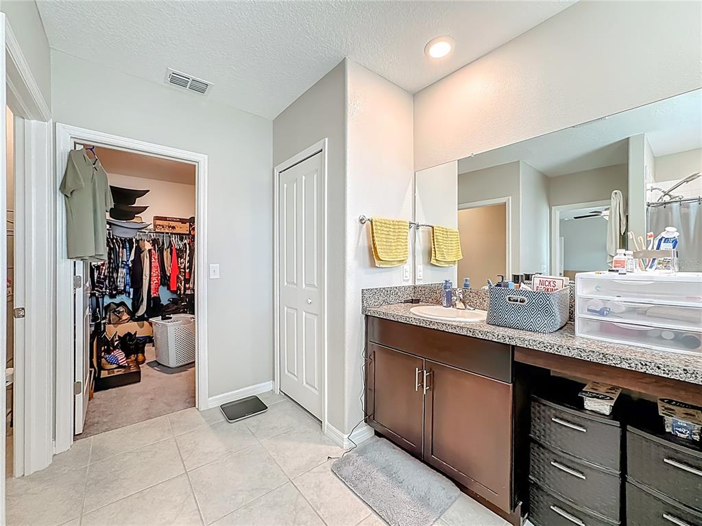 1511 Tiger Tooth Place Ruskin, FL 33570 - Photo 36 of 59 a bathroom with a sink double vanity and a mirror