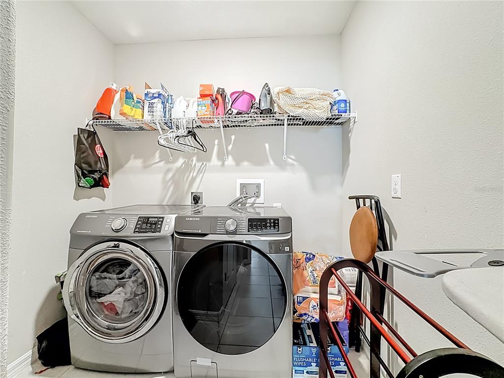 1511 Tiger Tooth Place Ruskin, FL 33570 - Photo 49 of 59 a utility room with dryer washer and other items