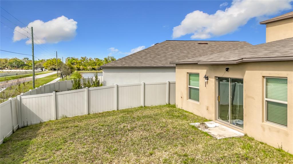 1511 Tiger Tooth Place Ruskin, FL 33570 - Photo 51 of 59 a view of a house with a backyard
