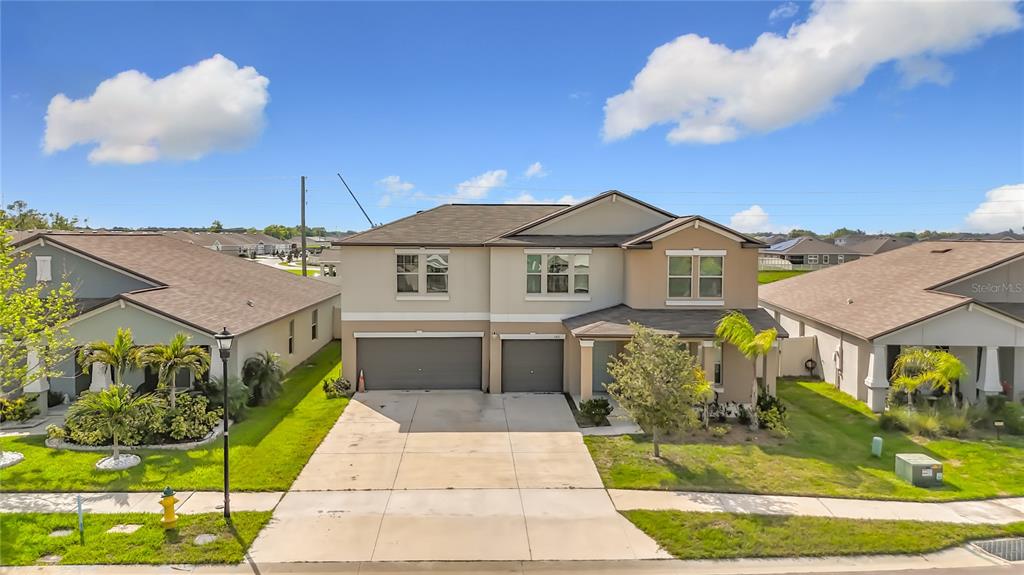 1511 Tiger Tooth Place Ruskin, FL 33570 - Photo 10 of 59 a front view of a house with a yard