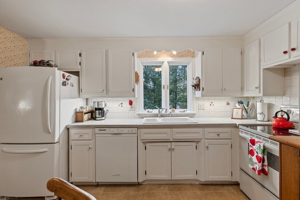 1 Conifer Drive Wilbraham, MA 01095 - Photo 13 of 42 a kitchen with white cabinets and white appliances