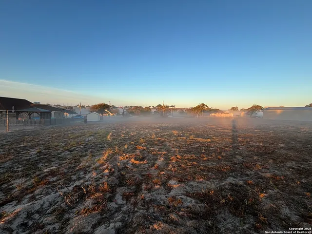 an aerial view of mountain with trees around