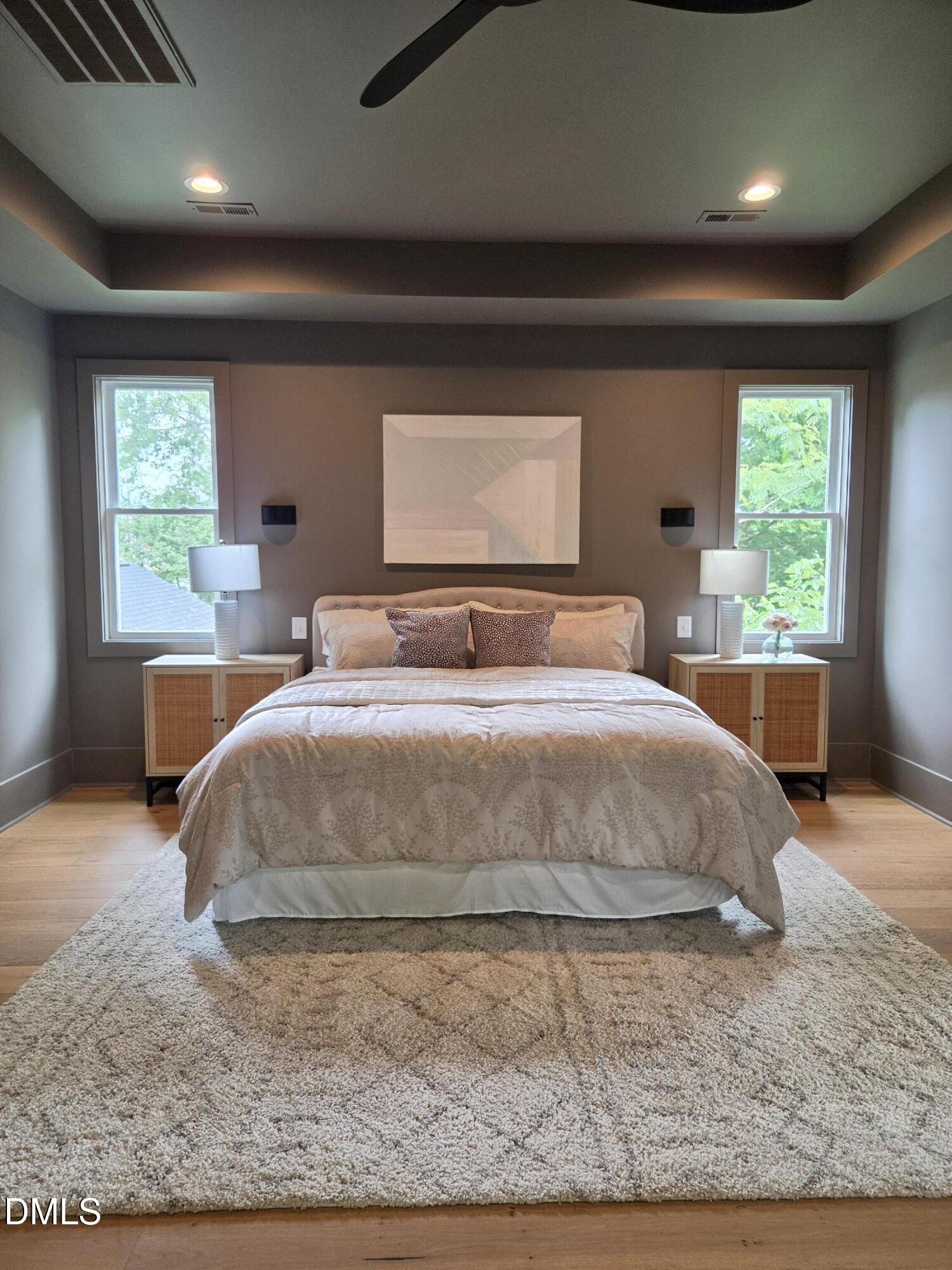 712 Van Buren Road Raleigh, NC 27604 - Photo 10 of 34 a bedroom with a large bed and wooden floor