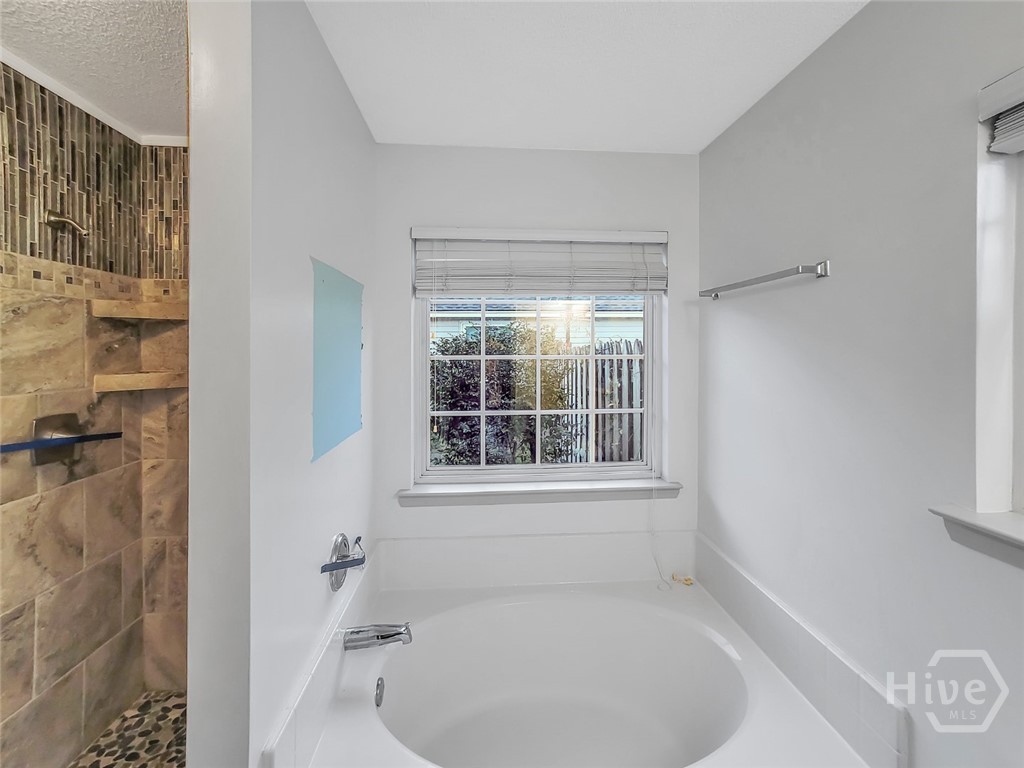 219 Jasper Lane Rincon, GA 31326 - Photo 25 of 46 RELAXING OWNER'S BATHROOM WITH GARDEN TUB AND SEPERATE TILED SHOWER