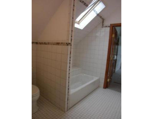 5 Longview Street Natick, MA 01760 - Photo 8 of 12 a bathroom with a bathtub and a shower