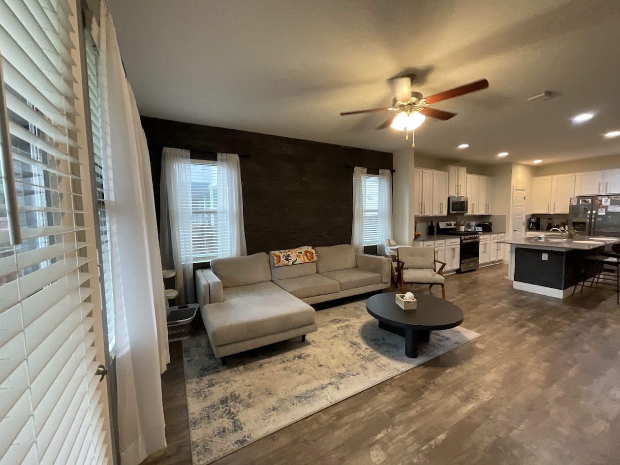 624 Golden Glory Road Leander, TX 78641 - Photo 15 of 39 Open-concept living space featuring wood-finish flooring, a contemporary ceiling fan, and recessed lighting