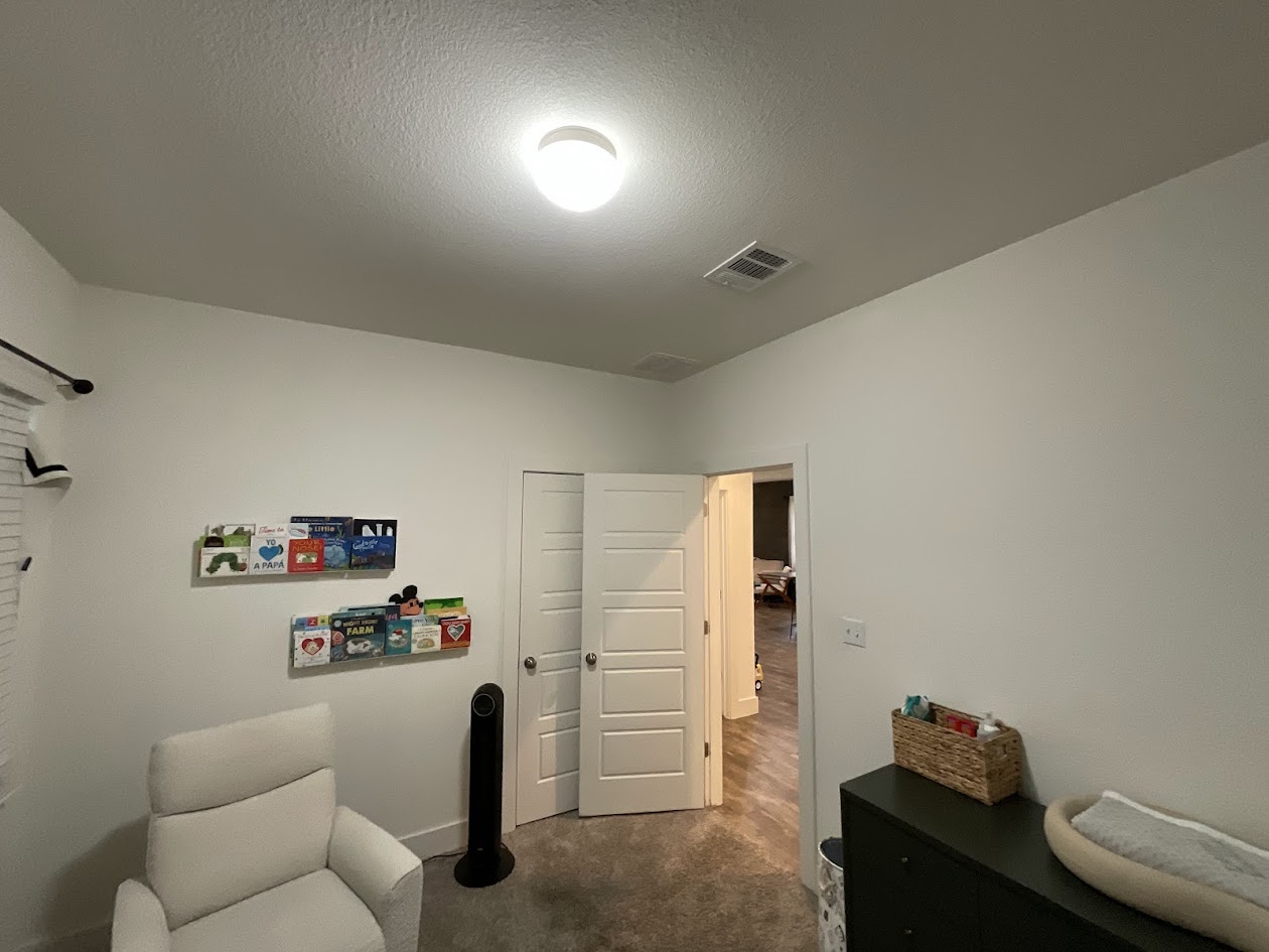 624 Golden Glory Road Leander, TX 78641 - Photo 25 of 39 Carpeted room with white walls, a flush-mount ceiling light, and a white interior door