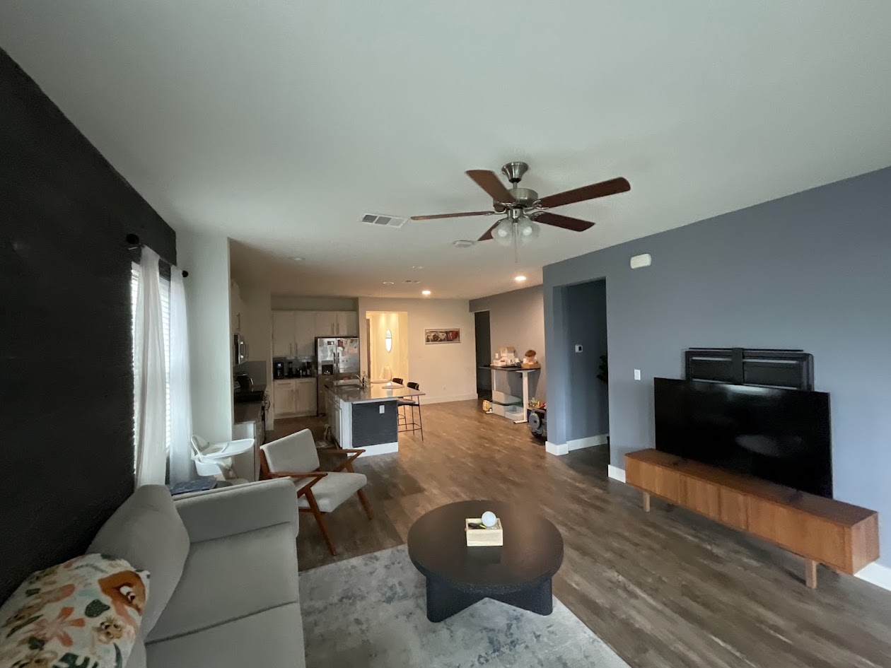 624 Golden Glory Road Leander, TX 78641 - Photo 31 of 39 Open-concept living area featuring wood-finish flooring, a ceiling fan with light fixture, and recessed lighting