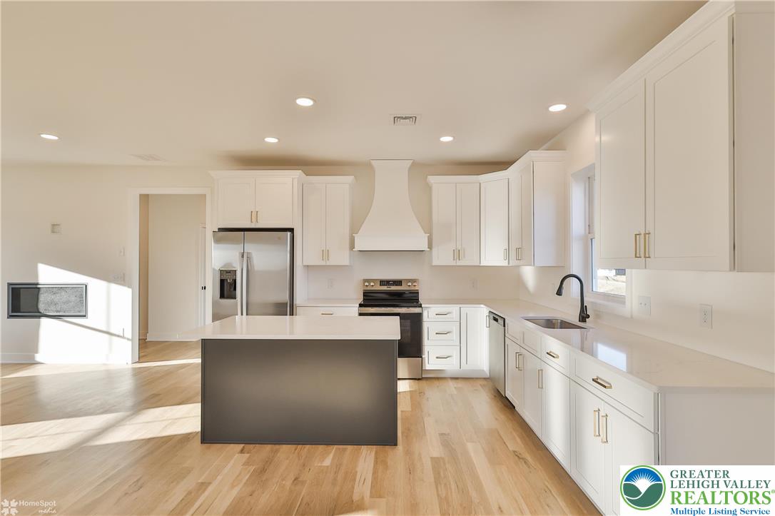 464 Long Lane Road Walnutport, PA 18088 - Photo 14 of 50 a large kitchen with stainless steel appliances granite countertop a large counter top a sink a stove and a refrigerator