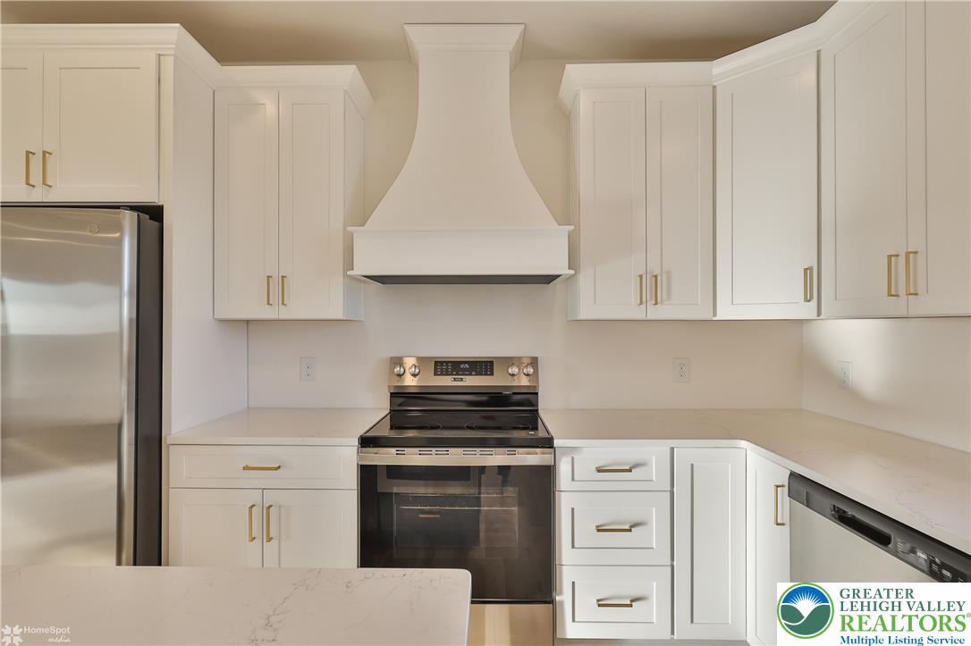 464 Long Lane Road Walnutport, PA 18088 - Photo 16 of 50 a kitchen with white cabinets and white appliances