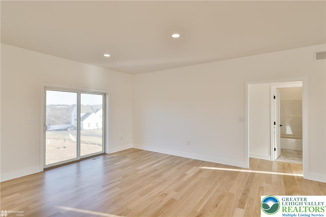 464 Long Lane Road Walnutport, PA 18088 - Photo 21 of 50 wooden floor in an empty room with a window