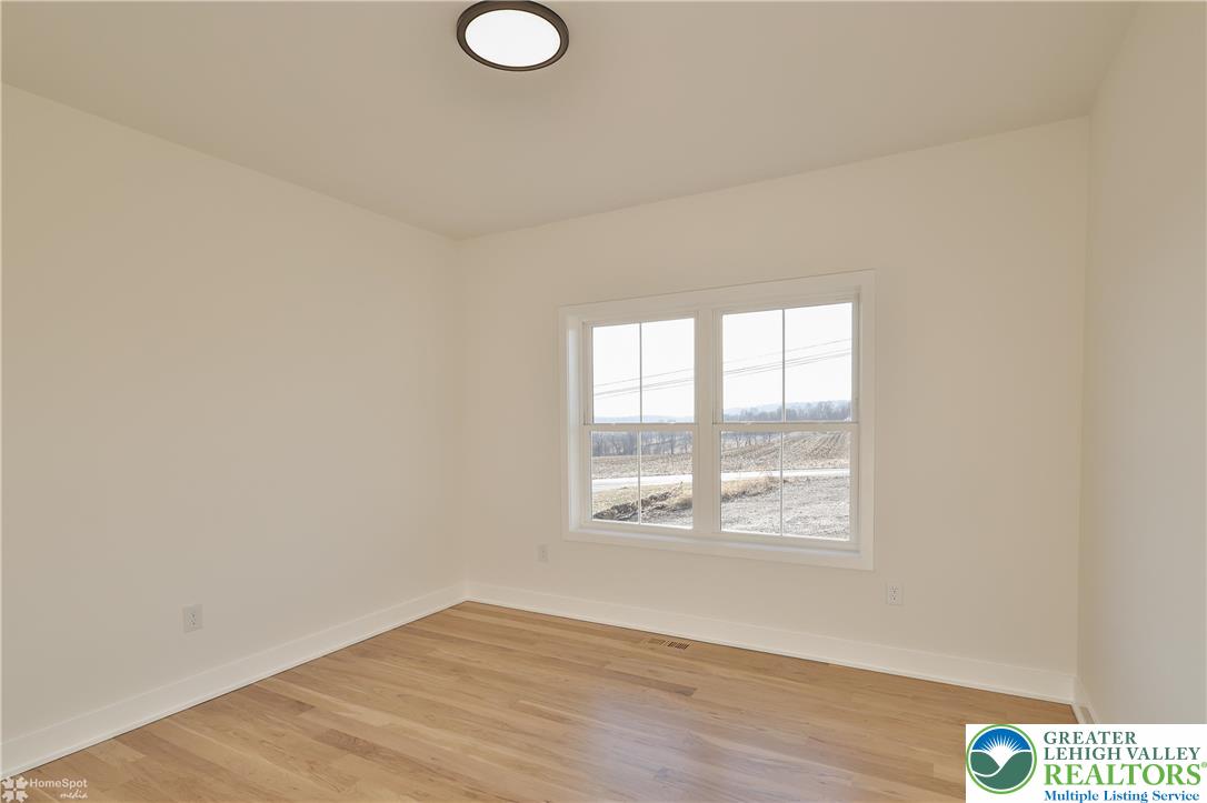 464 Long Lane Road Walnutport, PA 18088 - Photo 25 of 50 a view of an empty room with wooden floor and a window