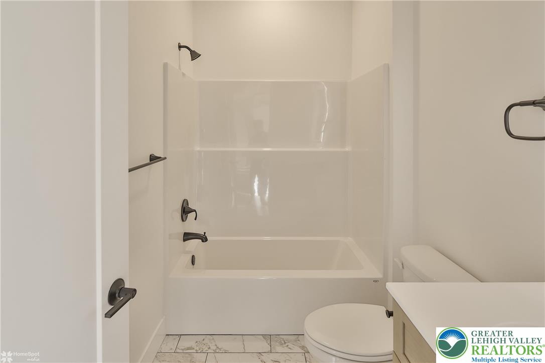 464 Long Lane Road Walnutport, PA 18088 - Photo 32 of 50 a bathroom with a toilet and a bath tub