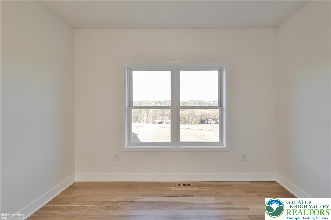 464 Long Lane Road Walnutport, PA 18088 - Photo 34 of 50 an empty room with wooden floor and windows