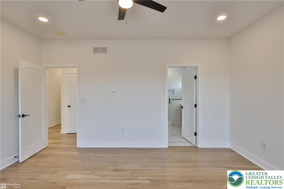 464 Long Lane Road Walnutport, PA 18088 - Photo 40 of 50 an empty room with wooden floor and windows