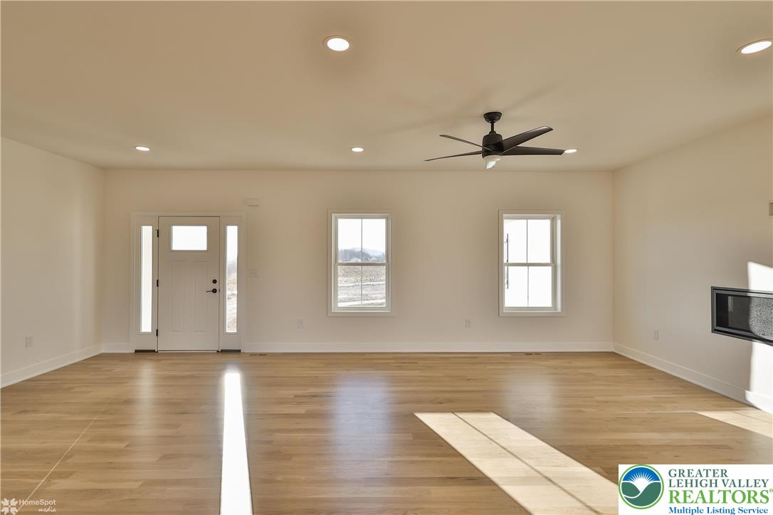 464 Long Lane Road Walnutport, PA 18088 - Photo 10 of 50 a view of a livingroom with a ceiling fan and window