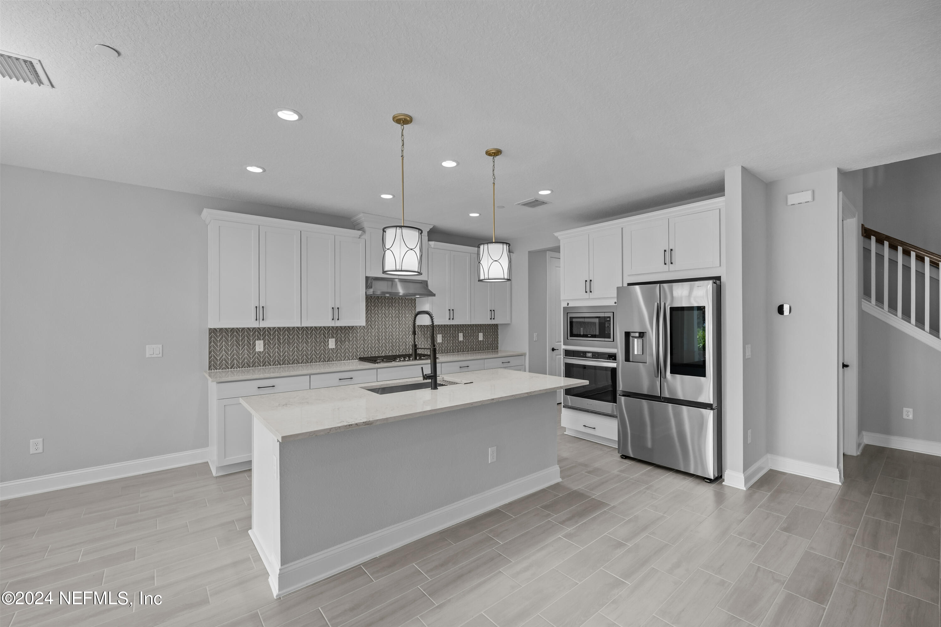 27 Oak Pk Drive St. Johns, FL 32259 - Photo 12 of 71 a large kitchen with a center island stainless steel appliances and cabinets