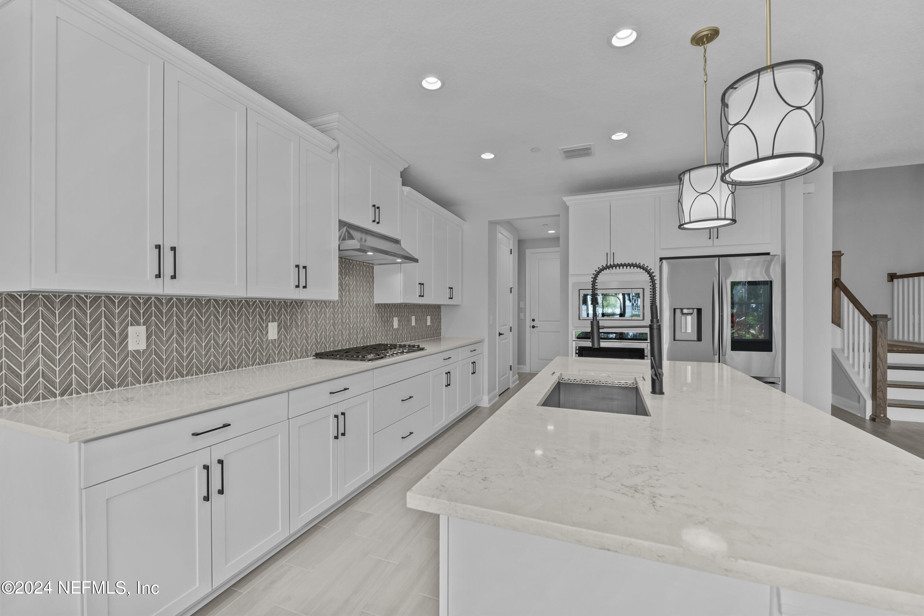 27 Oak Pk Drive St. Johns, FL 32259 - Photo 14 of 71 a large white kitchen with stainless steel appliances