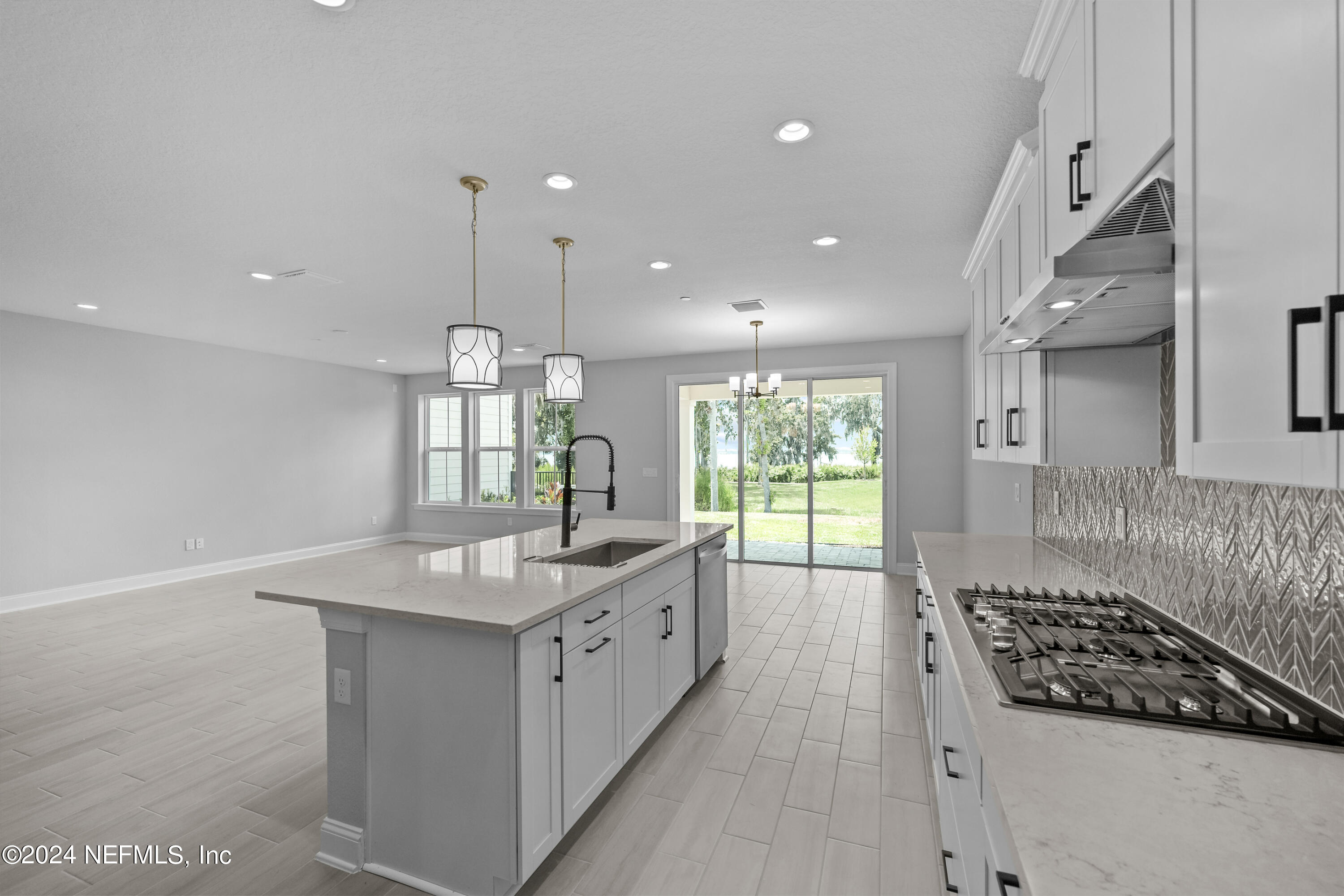 27 Oak Pk Drive St. Johns, FL 32259 - Photo 17 of 71 a kitchen with granite countertop a sink stove and cabinets