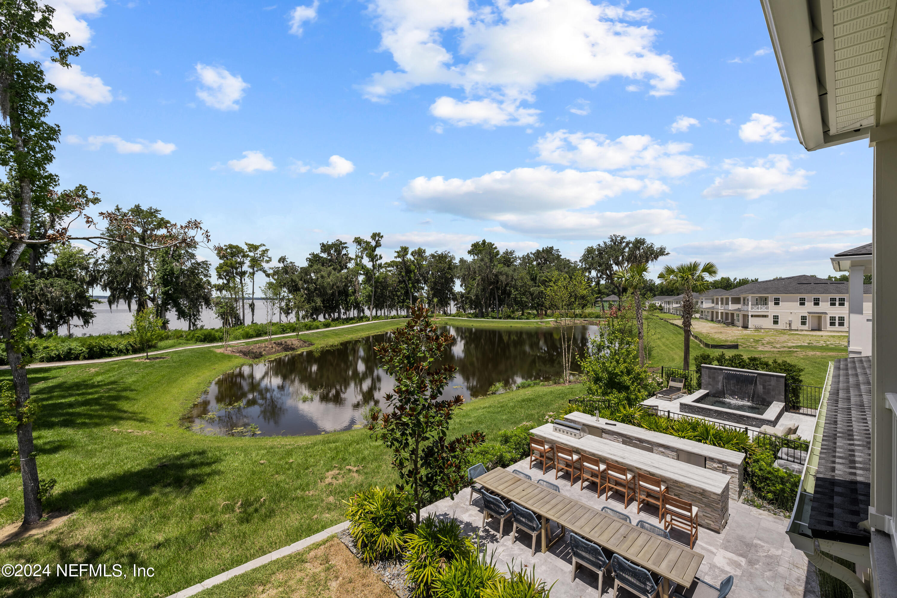 27 Oak Pk Drive St. Johns, FL 32259 - Photo 28 of 71 a view of a garden with plants and a lake view
