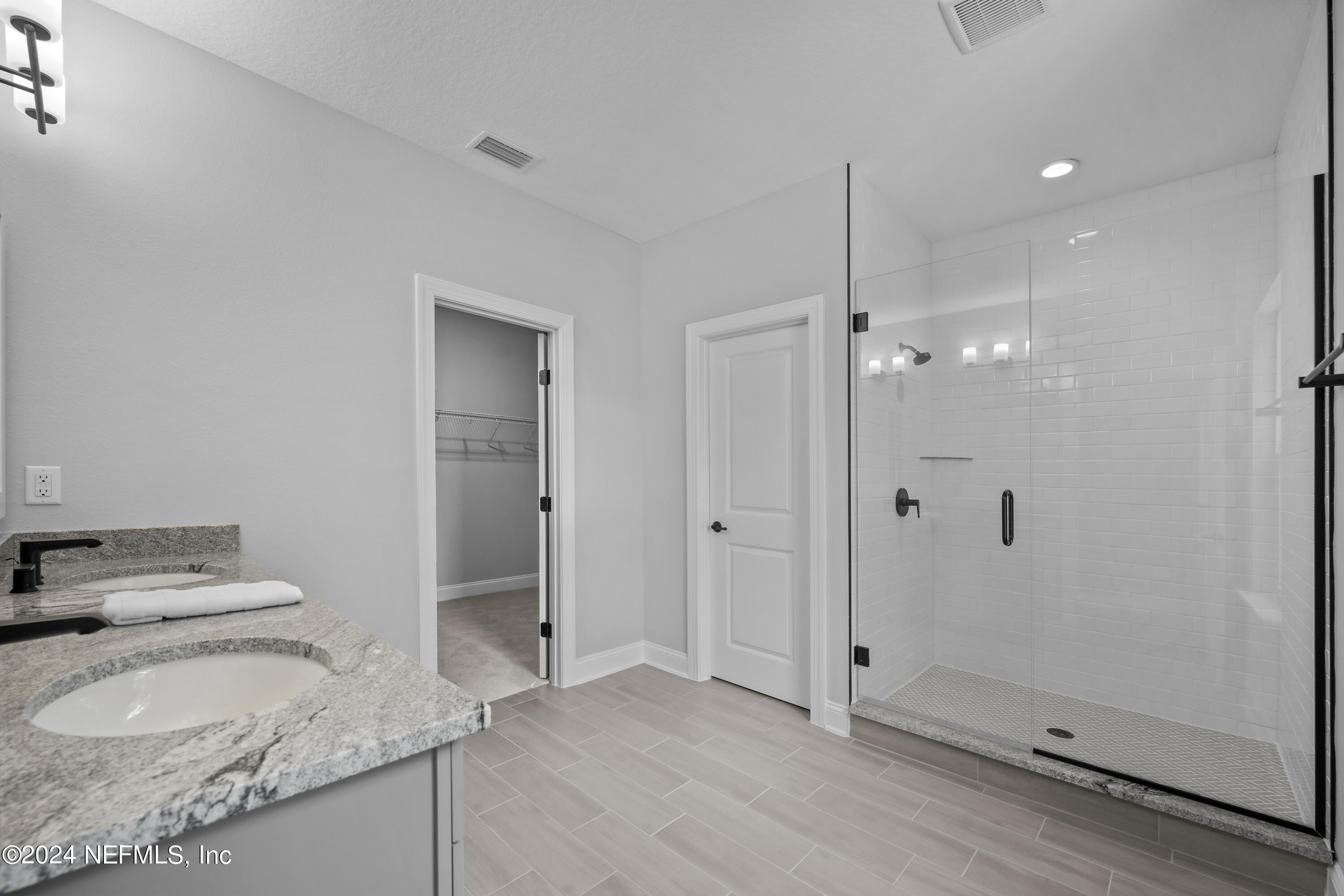 27 Oak Pk Drive St. Johns, FL 32259 - Photo 32 of 71 a bathroom with a granite countertop sink and shower