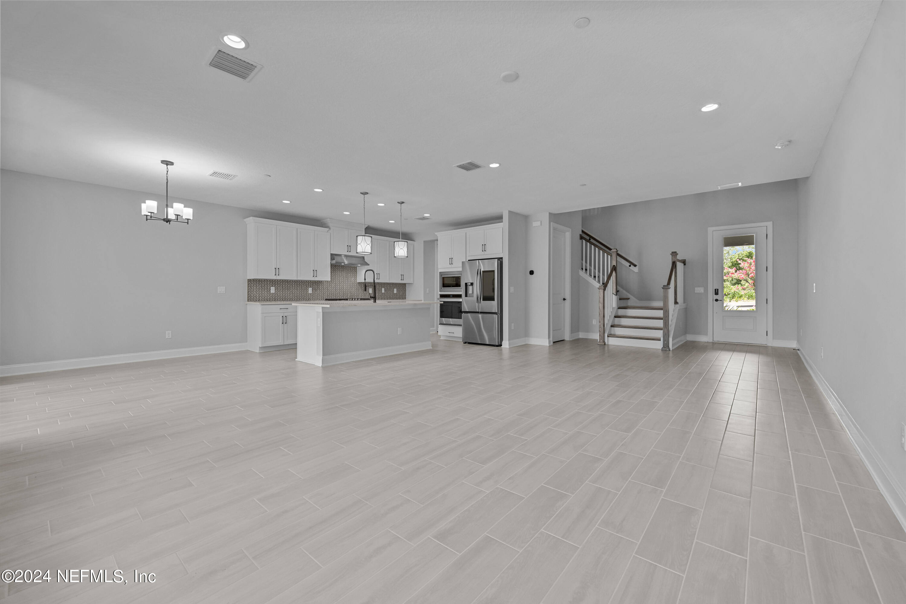 27 Oak Pk Drive St. Johns, FL 32259 - Photo 7 of 71 a view of kitchen with refrigerator stove and wooden floor