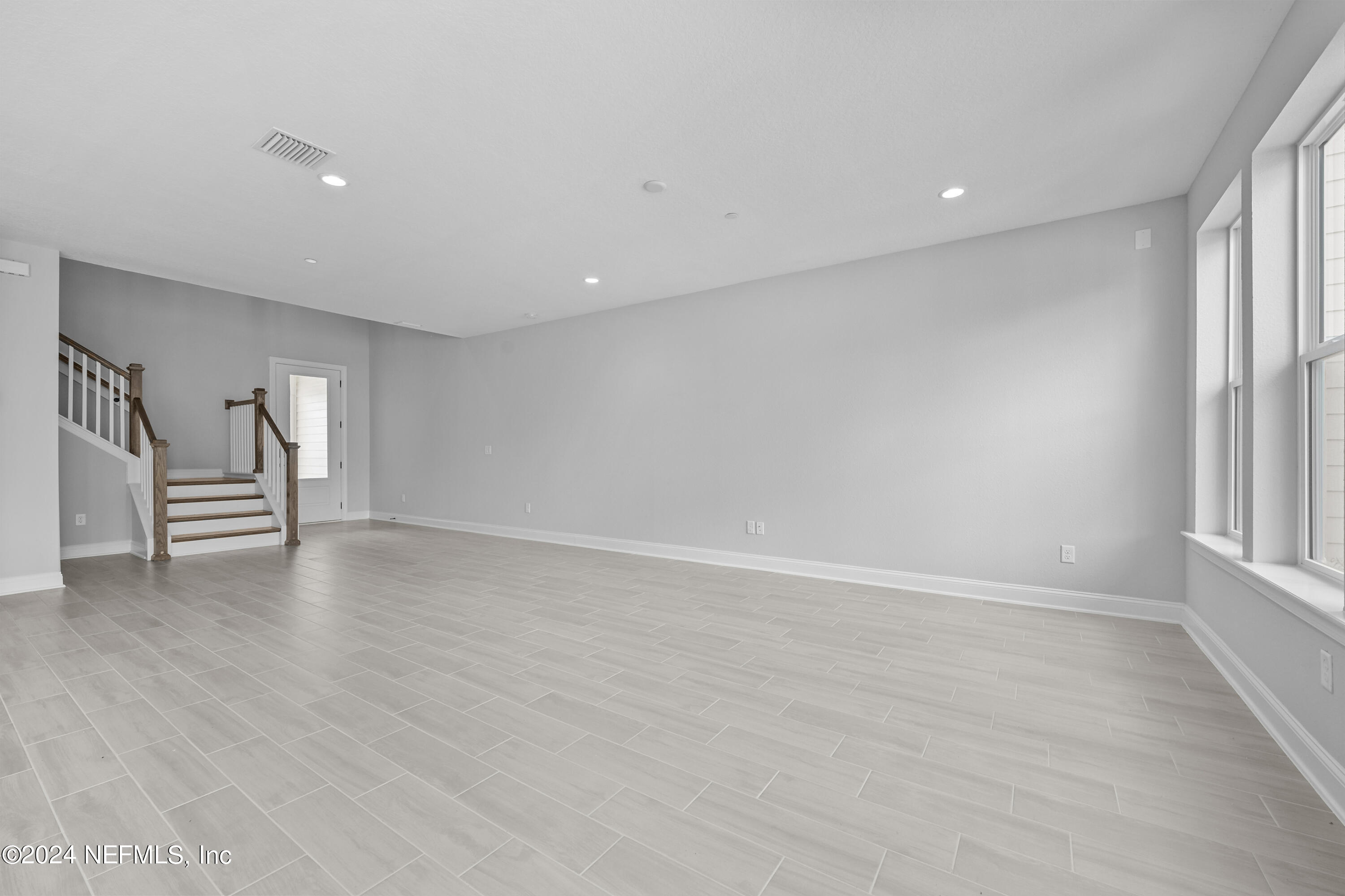 27 Oak Pk Drive St. Johns, FL 32259 - Photo 9 of 71 a view of empty room with wooden floor and fan