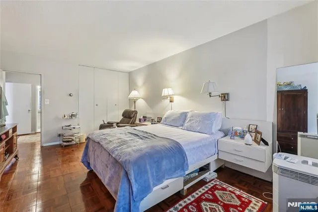 a bedroom with a bed and a couch