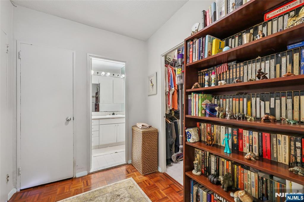 6 Horizon Road, Unit 2106 Fort Lee, NJ 07024 - Photo 14 of 20 a view of a book shelf with a book shelf