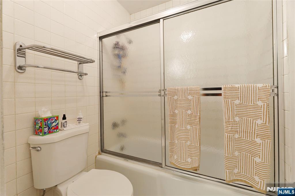 6 Horizon Road, Unit 2106 Fort Lee, NJ 07024 - Photo 15 of 20 a bathroom with a shower a toilet and a shower