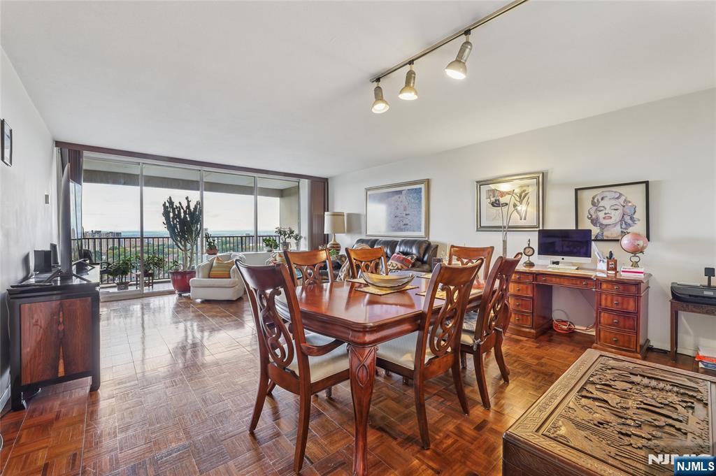 6 Horizon Road, Unit 2106 Fort Lee, NJ 07024 - Photo 9 of 20 a view of a dining room with furniture large windows and wooden floor