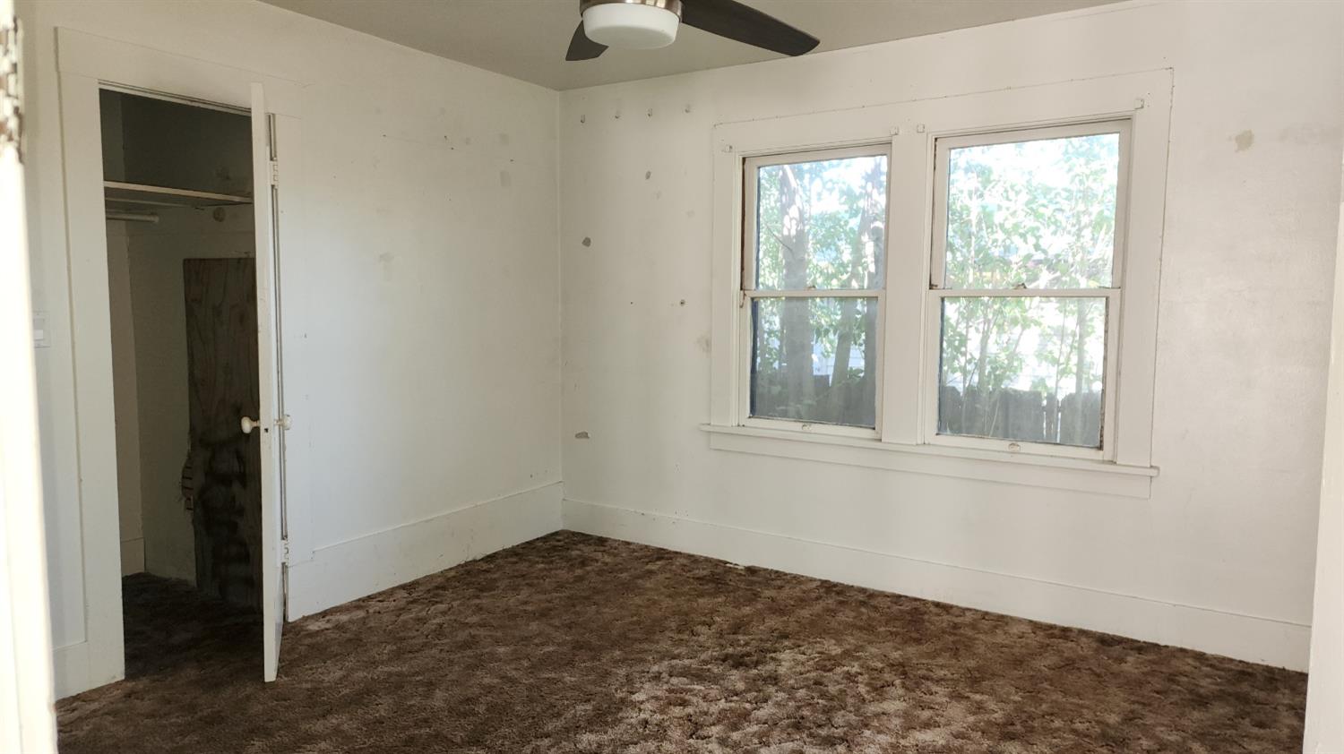 406 2nd Street Arbuckle, CA 95912 - Photo 14 of 31 an empty room with windows and closet