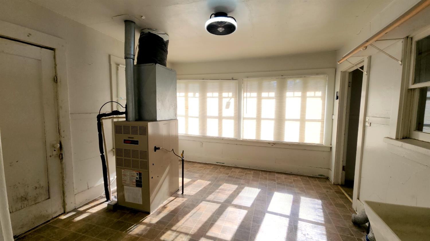 406 2nd Street Arbuckle, CA 95912 - Photo 27 of 31 a view of empty room with wooden floor and fan