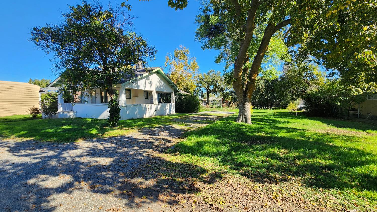 406 2nd Street Arbuckle, CA 95912 - Photo 7 of 31 a front view of a house with a yard
