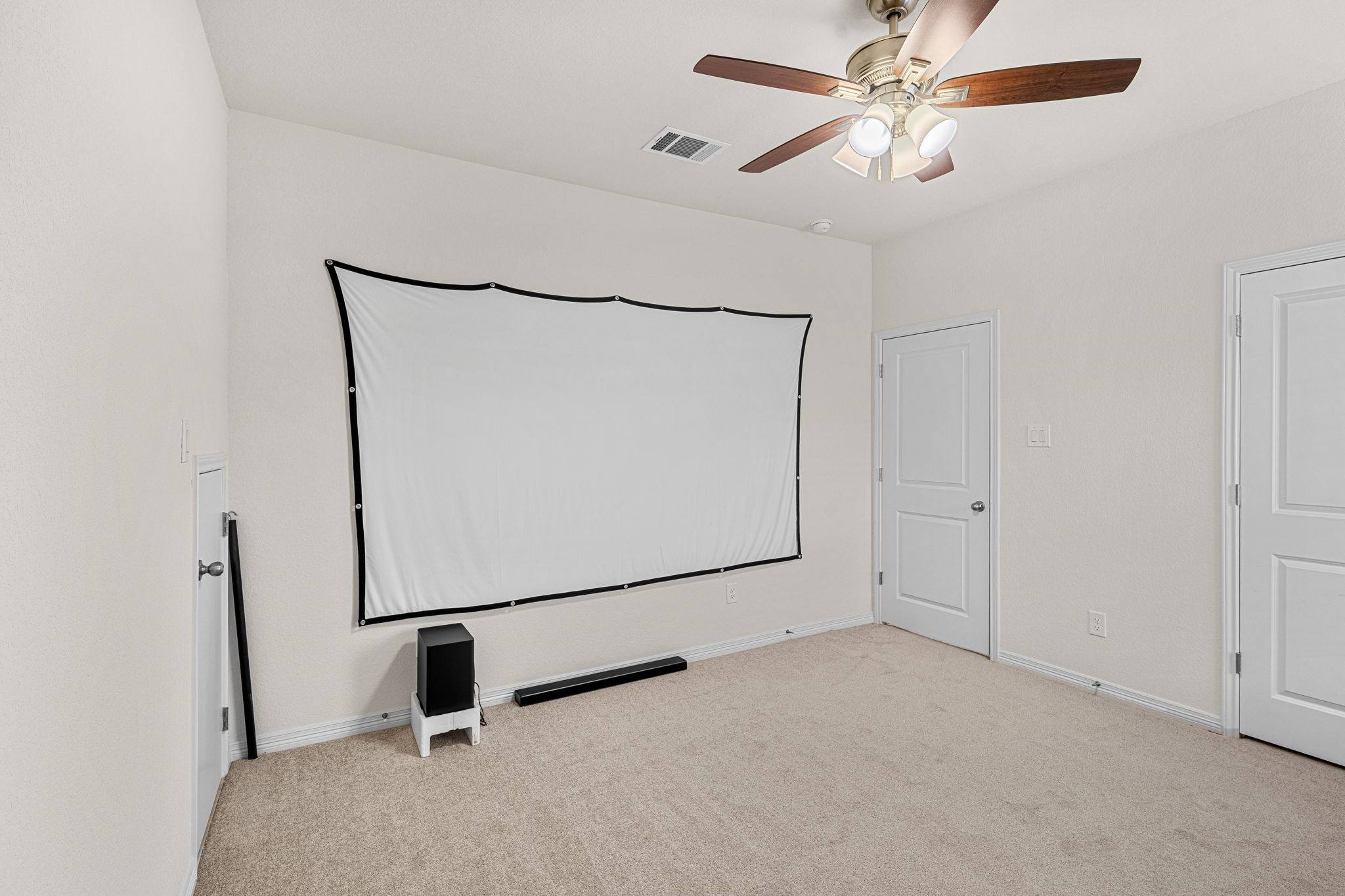 20813 Carries Ranch Road Pflugerville, TX 78660 - Photo 25 of 40 Soft carpeting underfoot defines this versatile space ready for media and entertainment setups.