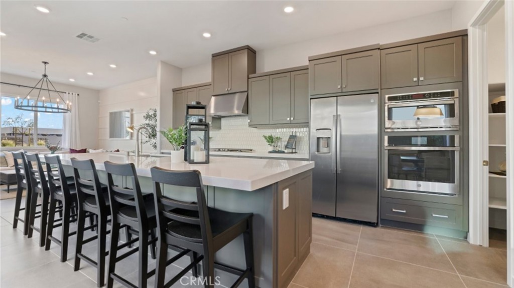 152 Baluster Irvine, CA 92618 - Photo 1 of 1 a kitchen with cabinets and stainless steel appliances