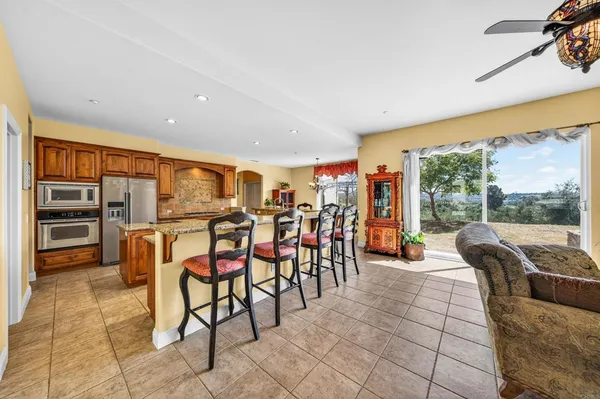 a kitchen with stainless steel appliances granite countertop a stove a sink dishwasher and cabinets