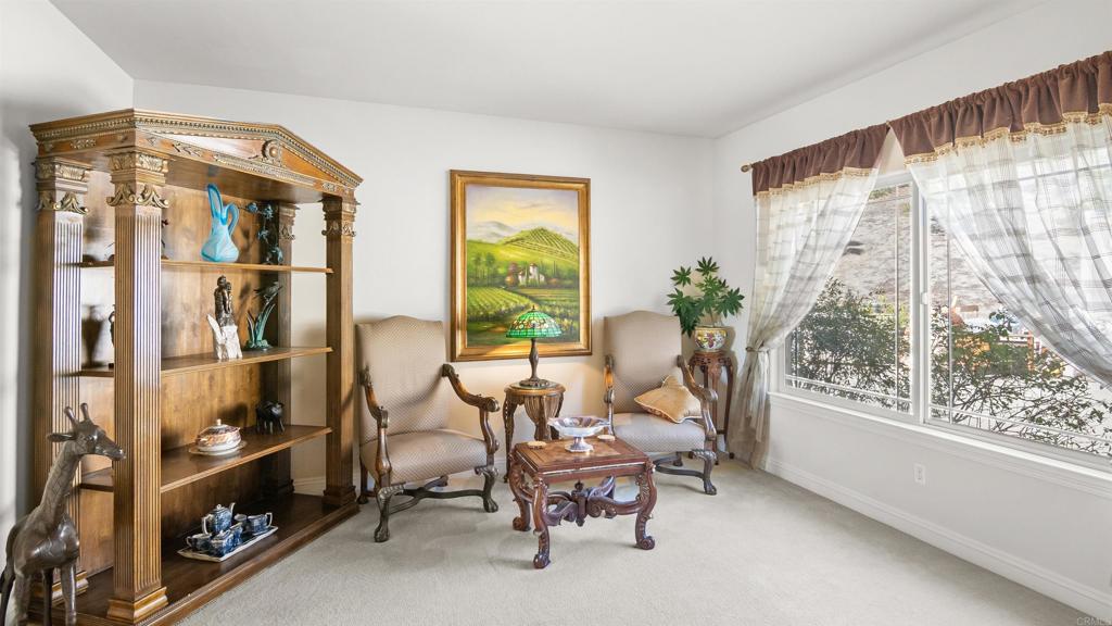 40487 Rock Mountain Drive Fallbrook, CA 92028 - Photo 14 of 57 a living room with furniture and a large window