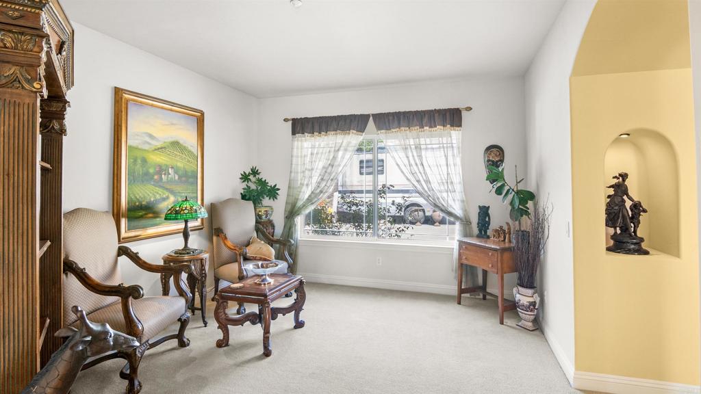40487 Rock Mountain Drive Fallbrook, CA 92028 - Photo 15 of 57 a living room with furniture and a large window