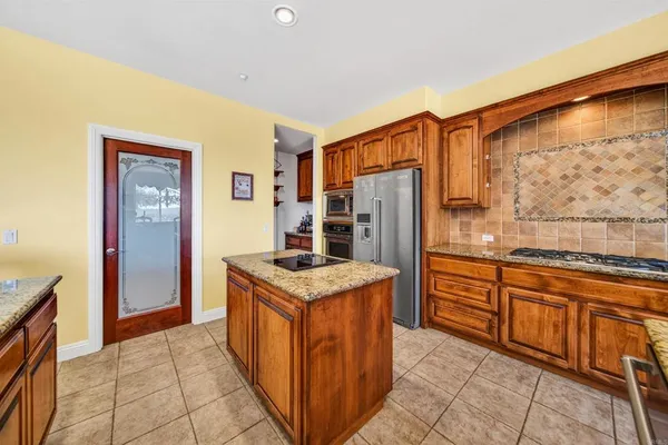 a group of chairs sitting in kitchen and dining room