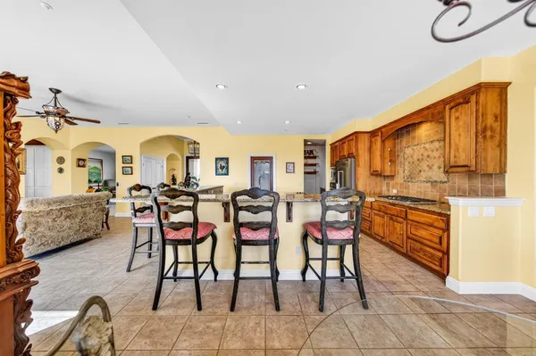 a hallway with painting and flower vase