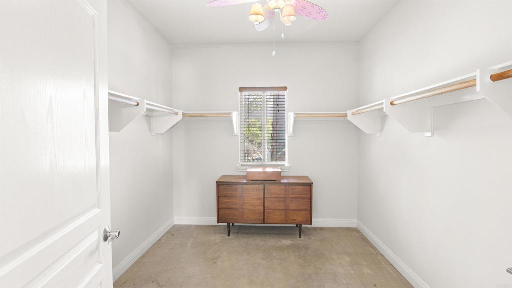 40487 Rock Mountain Drive Fallbrook, CA 92028 - Photo 32 of 57 a room that has a chair and a window in it