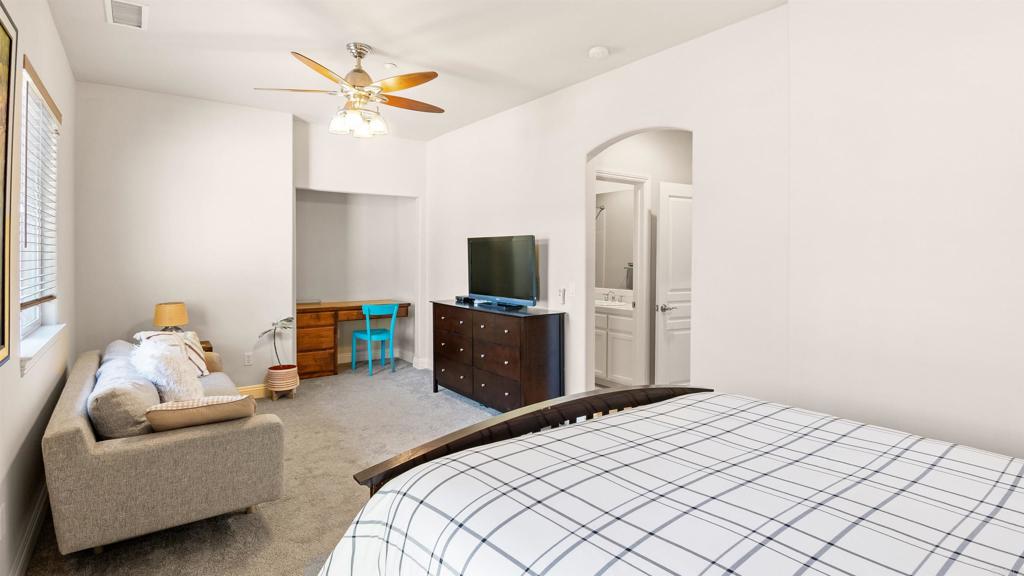 40487 Rock Mountain Drive Fallbrook, CA 92028 - Photo 36 of 57 a bedroom with a bed and a chandelier