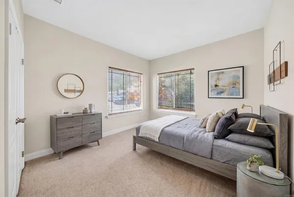 a view of a house with a patio and a yard
