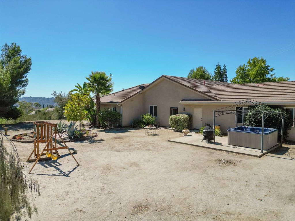 40487 Rock Mountain Drive Fallbrook, CA 92028 - Photo 50 of 57 a view of a house with backyard and sitting area